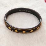 Van Cleef & Aepels Unisex Black Alhambra Bracelet With Gold Clover Charm